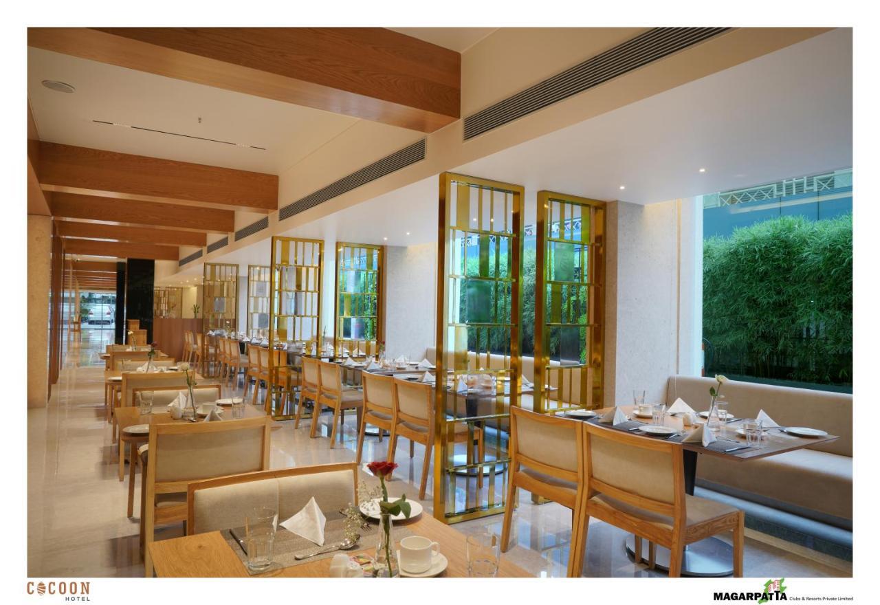 Cocoon Hotel Pune Bagian luar foto